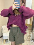 Pull bordeaux avec ouverture sur le côté