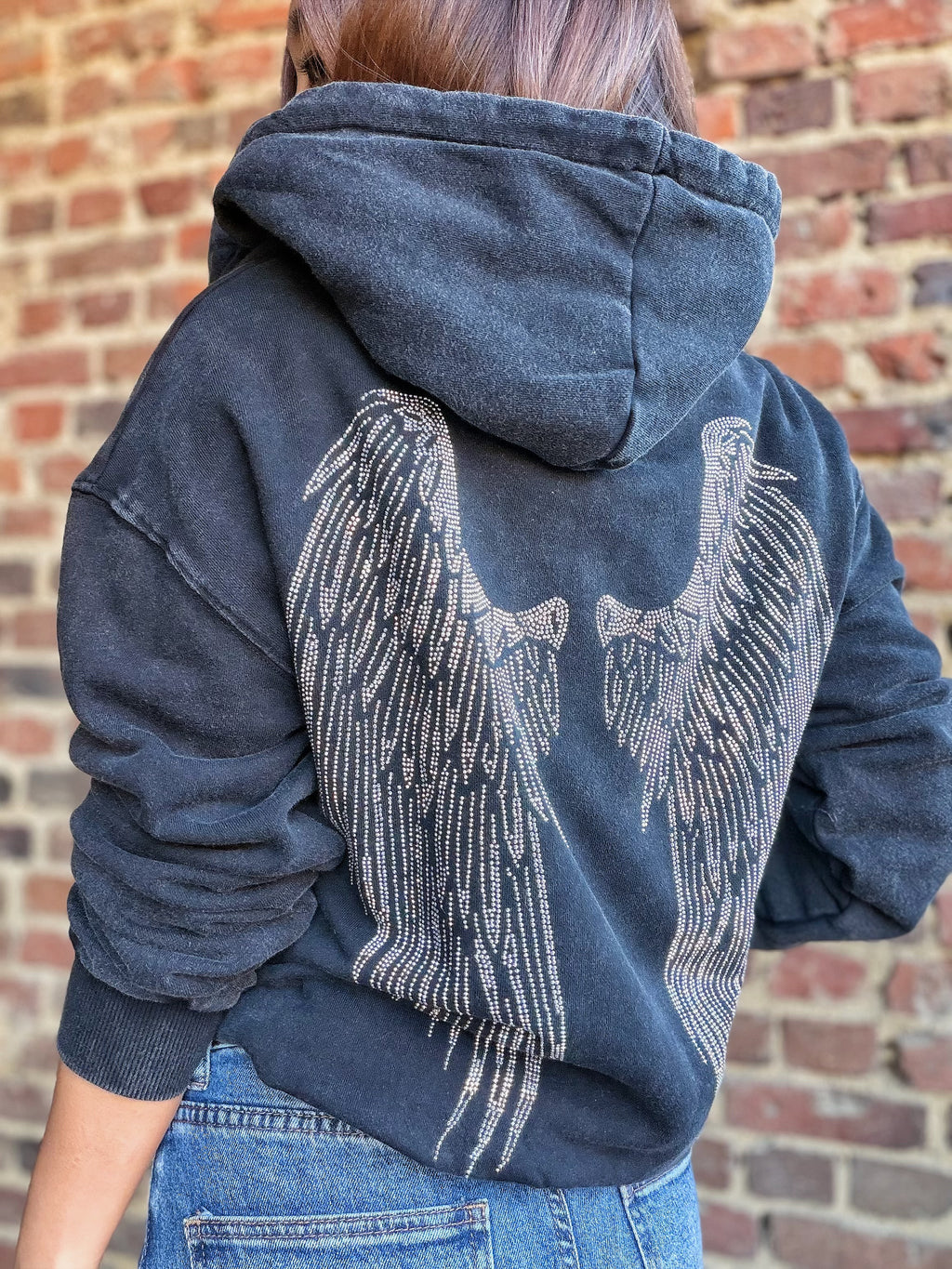 Sweat noir avec des strass