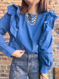Blouse bleue unie à volants