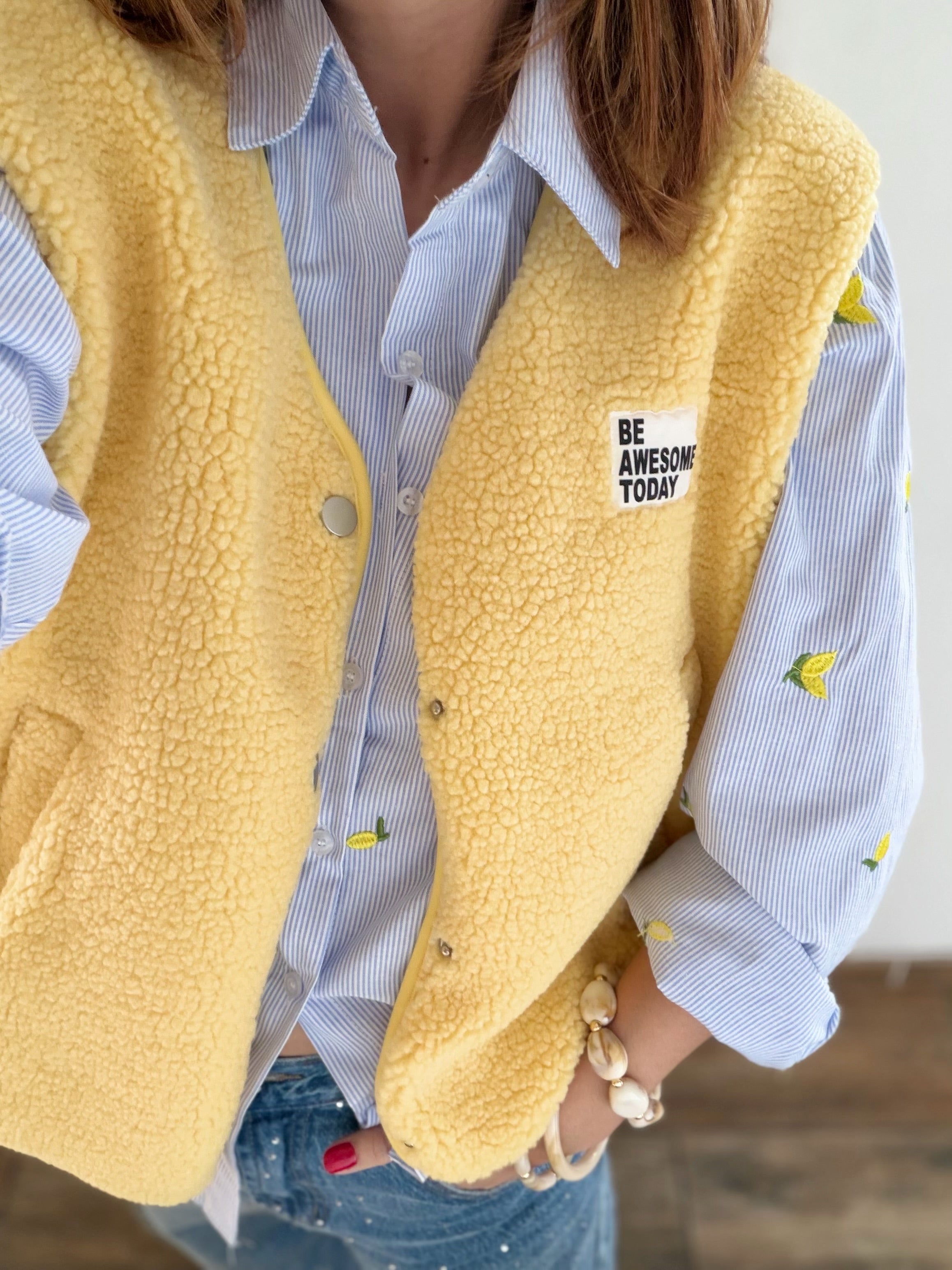 Veste jaune moumoute sans manches