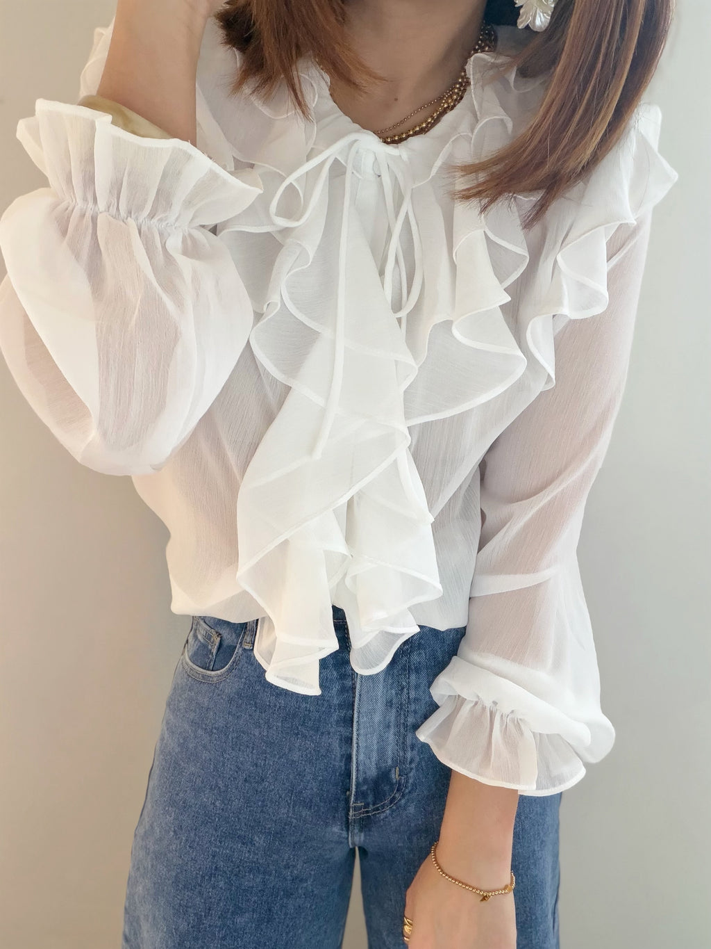 Blouse transparente à volants