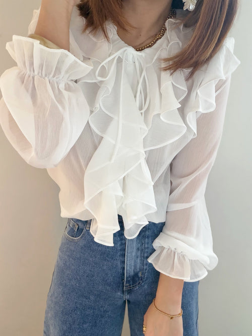 Blouse transparente à volants